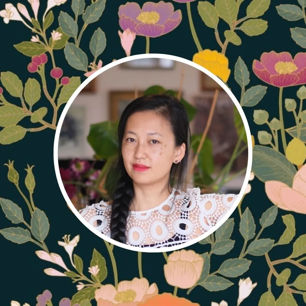 Headshot of Cecilia Mok with one of her prints in the background.